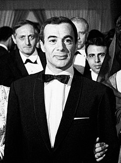 Yacef Saadi, commander of the FLN's Algiers autonomous zone and architect of the Battle of Algiers bombing campaign, photographed during his years of political and cultural activity. Saadi built and ran the most effective urban guerrilla network of the Algerian War, mentoring Ali La Pointe, Zohra Drif, and Hassiba Ben Bouali, was captured in September 1957, survived to independence, produced the landmark film The Battle of Algiers, and served as an Algerian senator.